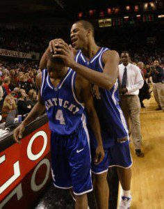 UK's Chuck Hayes and Rajon Rondo celebrate as they leave the floor after the University of Kentucky beat the University of Louisville 60-58 in Freedom Hall in Louisville, Ky., on Dec. 18, 2004.